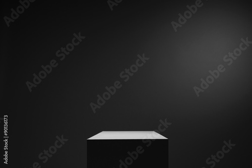Murais de parede White cube box in dark space and background, light from top