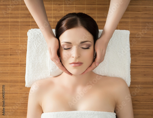 Young, beautiful and healthy woman in spa salon. Traditional ori