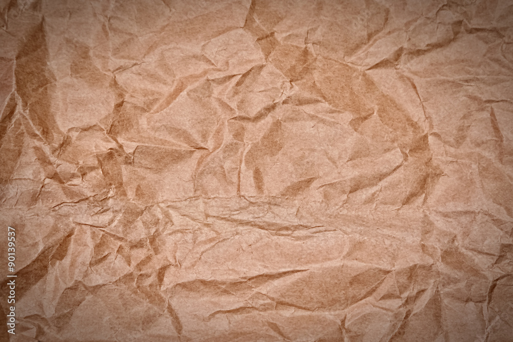 Fototapeta premium crumpled brown paper background or texture