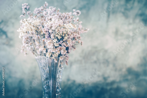 Dry flower in tall and transparent vase