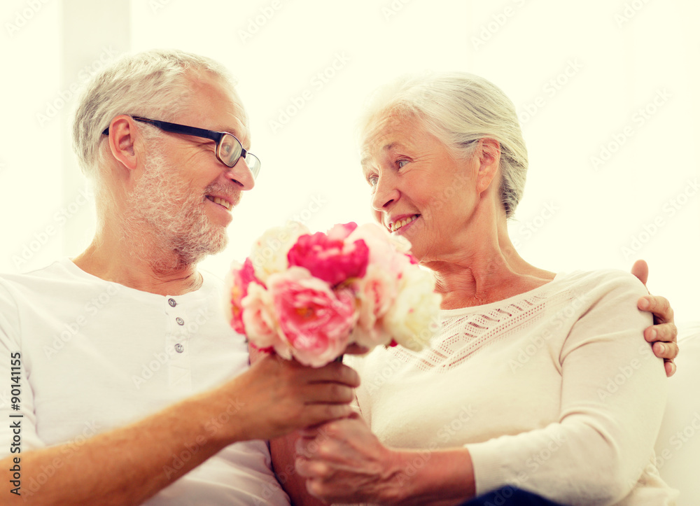 happy senior couple with bunch of flowers at home happy senior couple with bunch of flowers at home