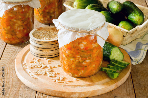 Quadro su tela preserves pearl barley, cucumber, pickle in the bank on a wooden