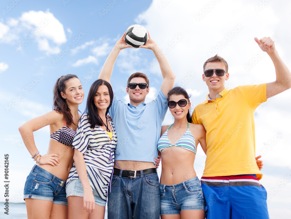 Fototapeta premium group of happy friends with beach ball