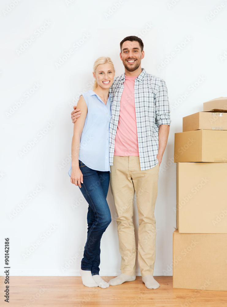 couple with cardboard boxes moving to new home couple with cardboard boxes moving to new home