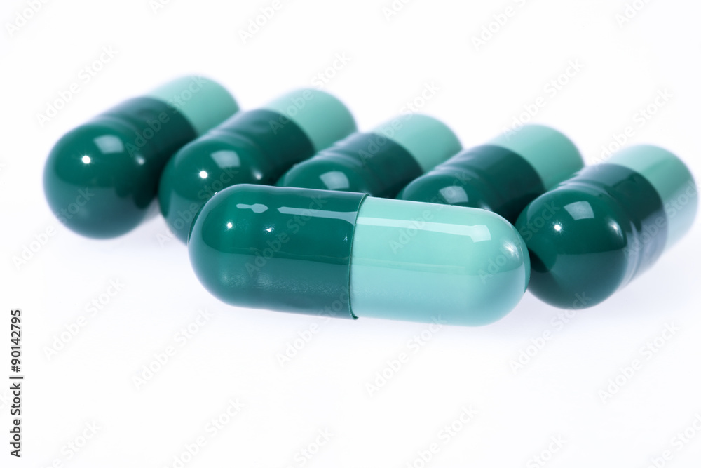 Two-piece medical capsule isolated on white background Two-piece medical capsule isolated on white background