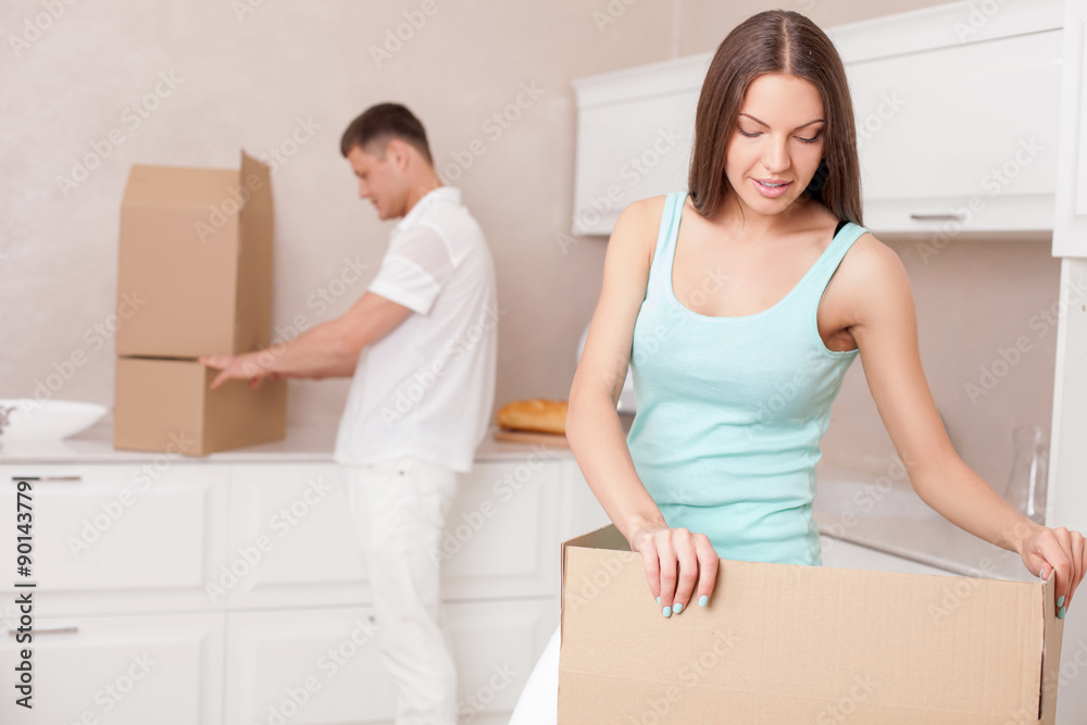 Cute husband and wife are moving in another building Cute husband and wife are moving in another building