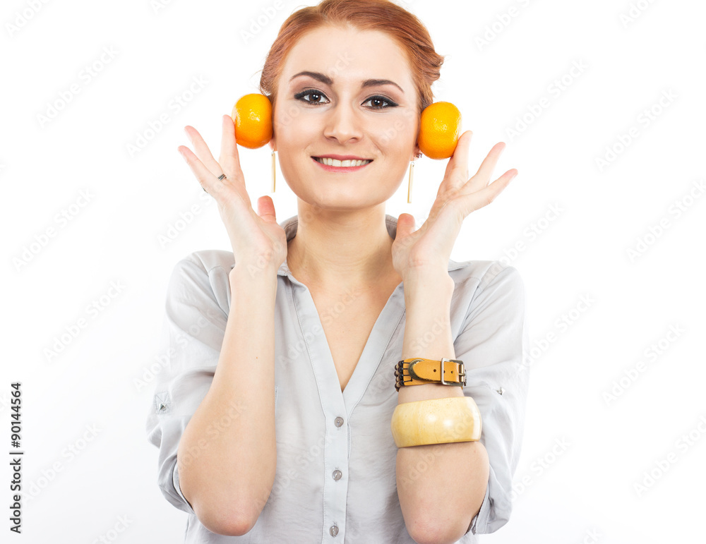 Young slim girl with tangerines. Portrait of a woman on a diet.
Young slim girl with tangerines. Portrait of a woman on a diet.