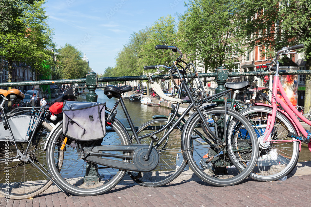 Bicycles at a bridge over an Amsterdam canal