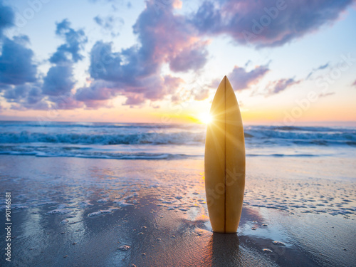Photography Surfboard on the beach at sunset