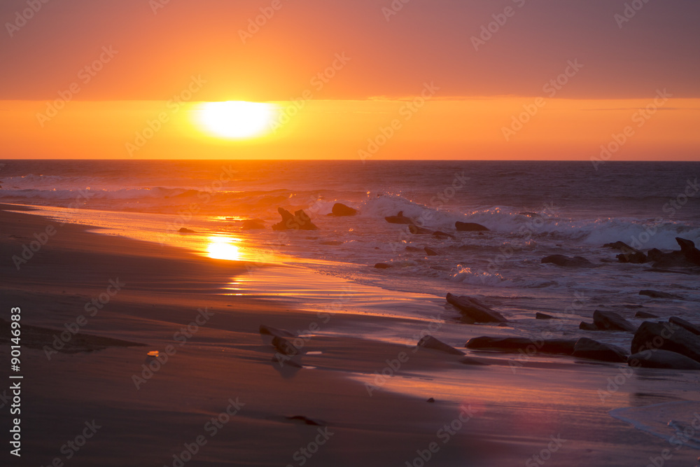 Ocean sunset on the beach and the Pacific Ocean in Punta Sal, Pe
