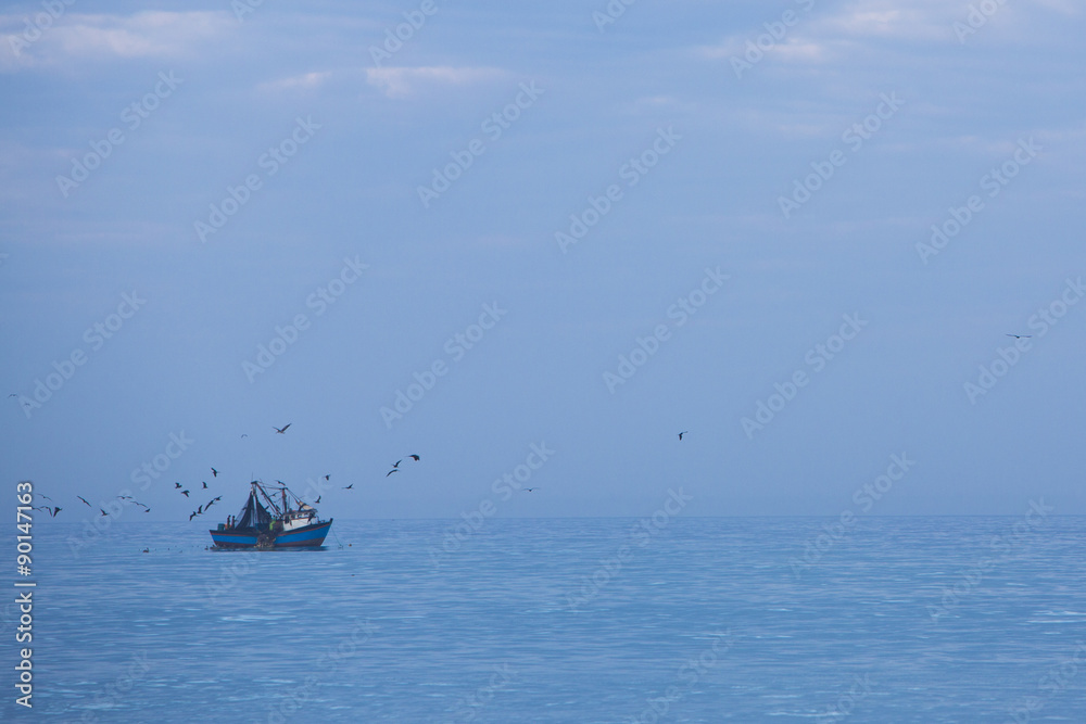Fisher ship, blue Pacific Ocean and many birds flying over, Peru Fisher ship, blue Pacific Ocean and many birds flying over, Peru