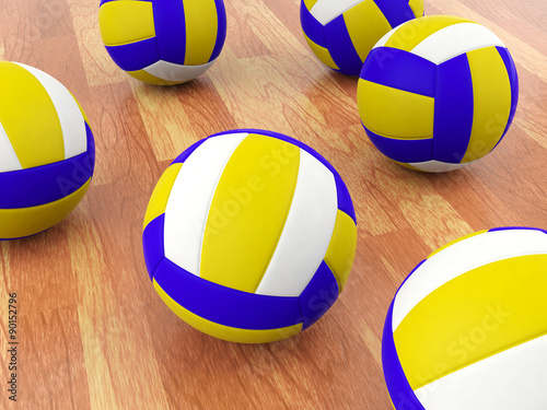 Volleyball balls on parquet floor