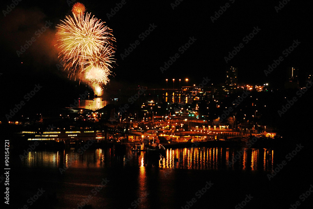 Fireworks exploding over the skyline of downtown Nanaimo at the start of the Bathtub Days weekend festivities.