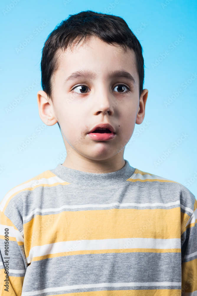 Studio shot of 5 years old boy with muddy face. Studio shot of 5 years old boy with muddy face.