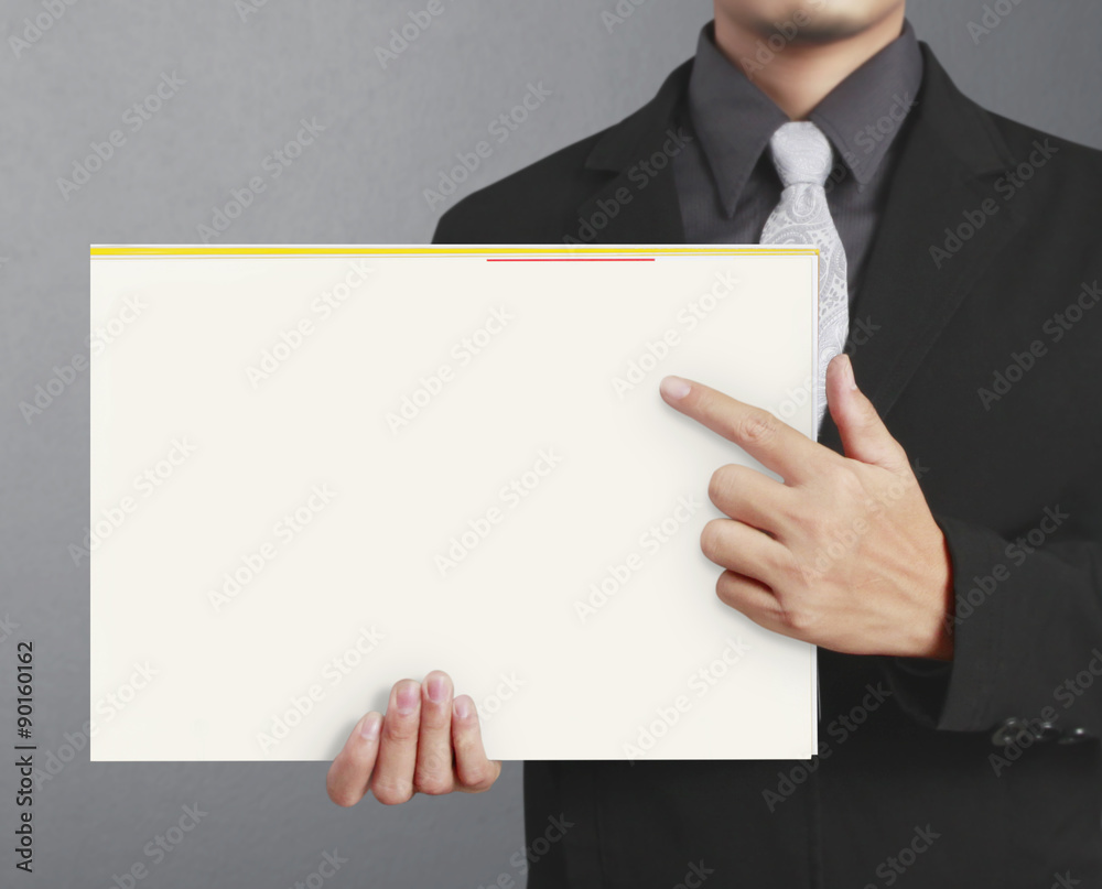 hand holding folded blank A4 hand holding folded blank A4
