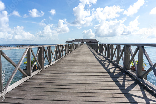 Wooden jetty with blue skies