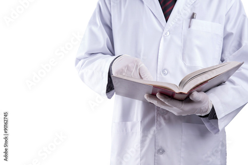 Doctor reading text book on white background 