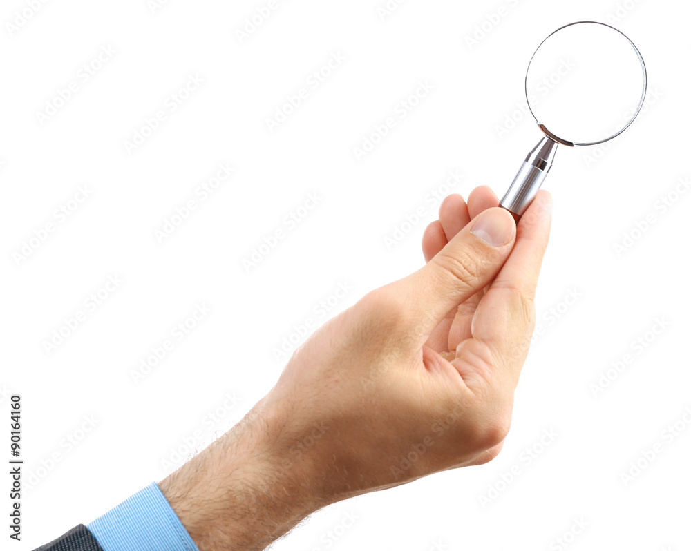 Male hand holding magnifying glass isolated on white