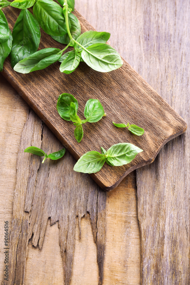 Green fresh basil on wooden background Green fresh basil on wooden background
