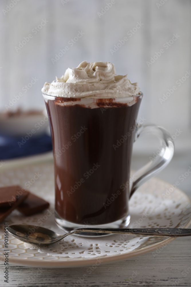 Cup of coffee with cream on color wooden background Cup of coffee with cream on color wooden background