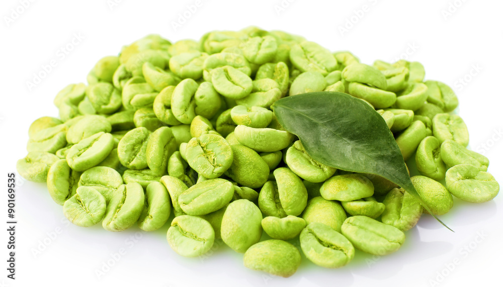 Heap of green coffee beans with leaf isolated on white Heap of green coffee beans with leaf isolated on white
