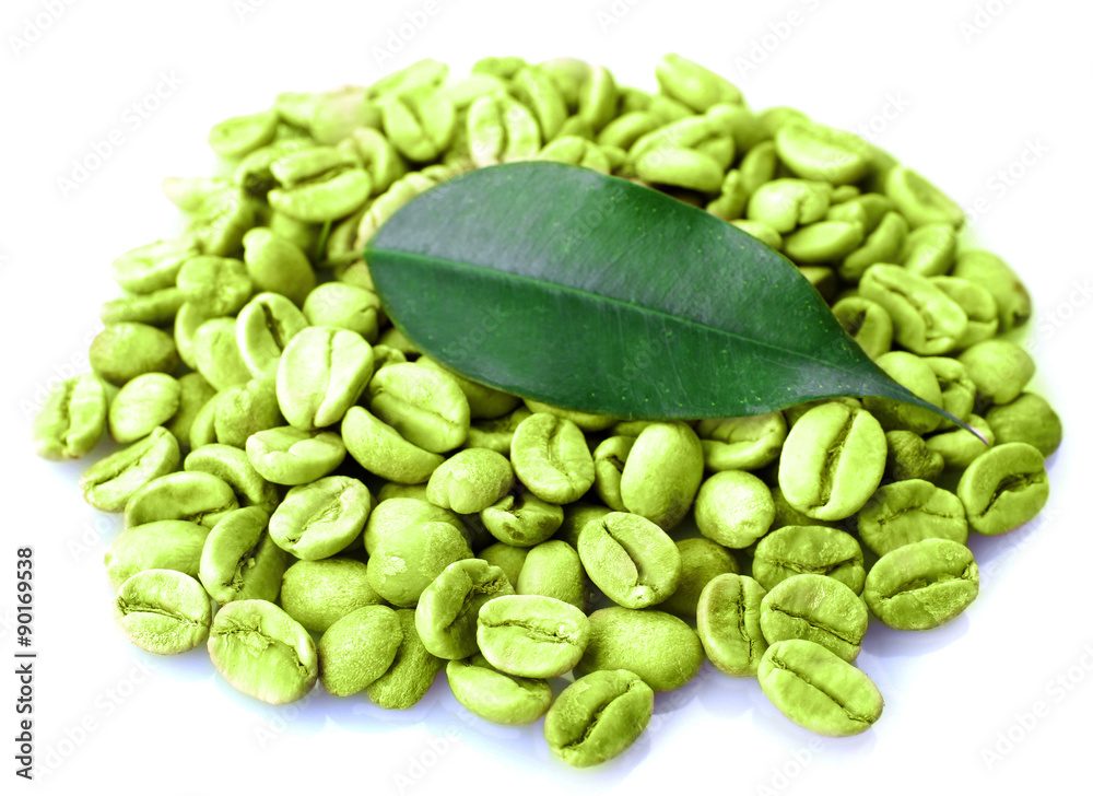 Heap of green coffee beans with leaf isolated on white Heap of green coffee beans with leaf isolated on white