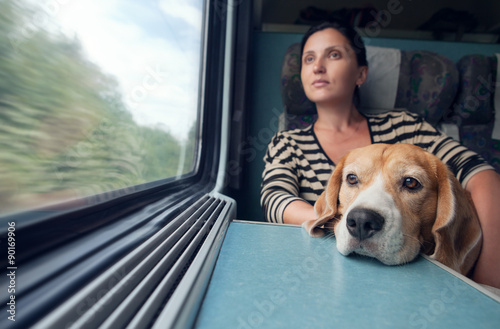 Woman with dog in the train wagon