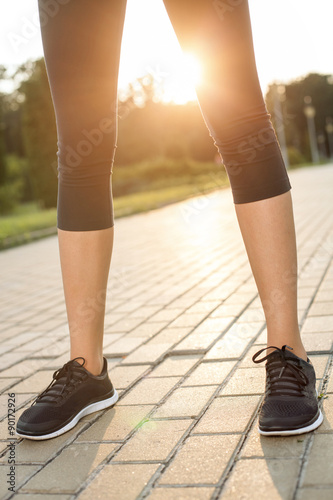 Young fit sportswoman is preparing for running