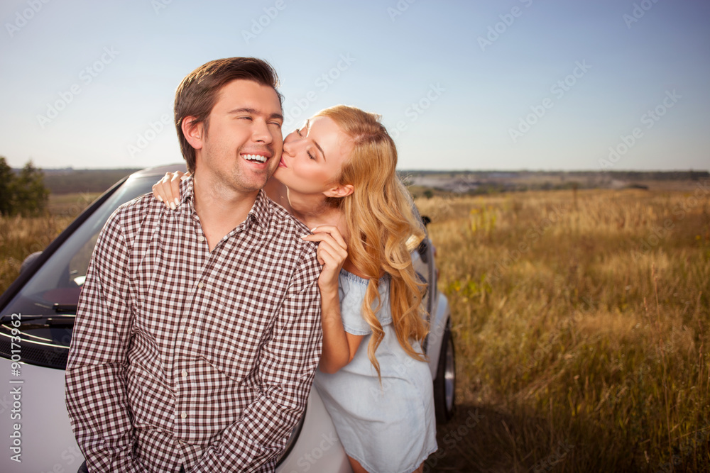 Obraz premium Cute young lovers are traveling by car