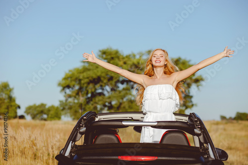 Attractive young loving couple is traveling by car