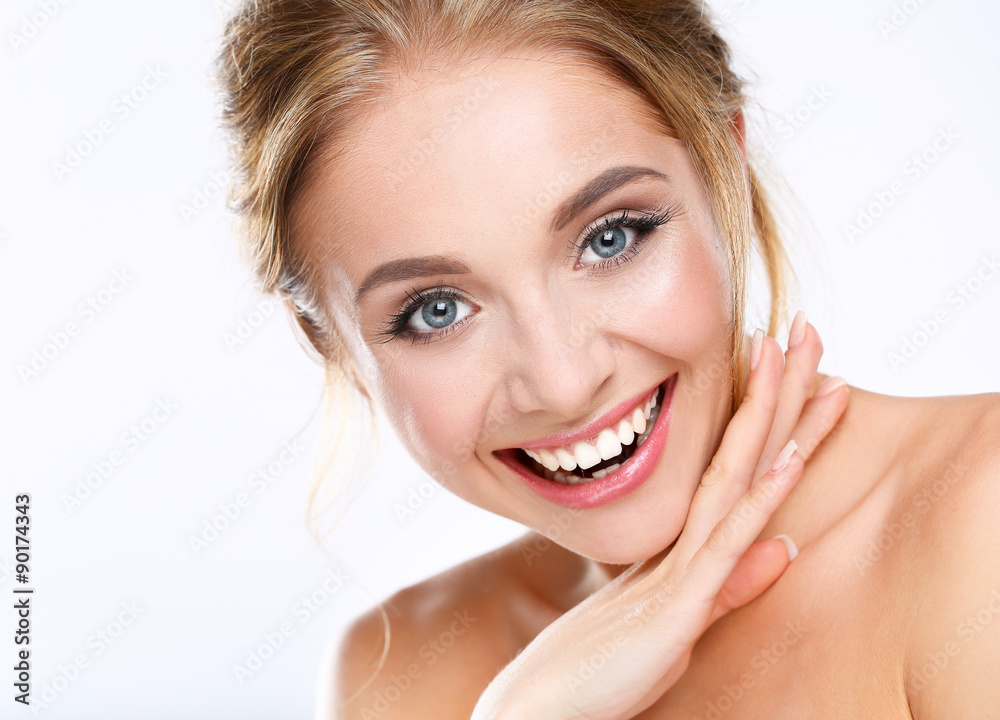 Young woman touching her face isolated on white background Young woman touching her face isolated on white background