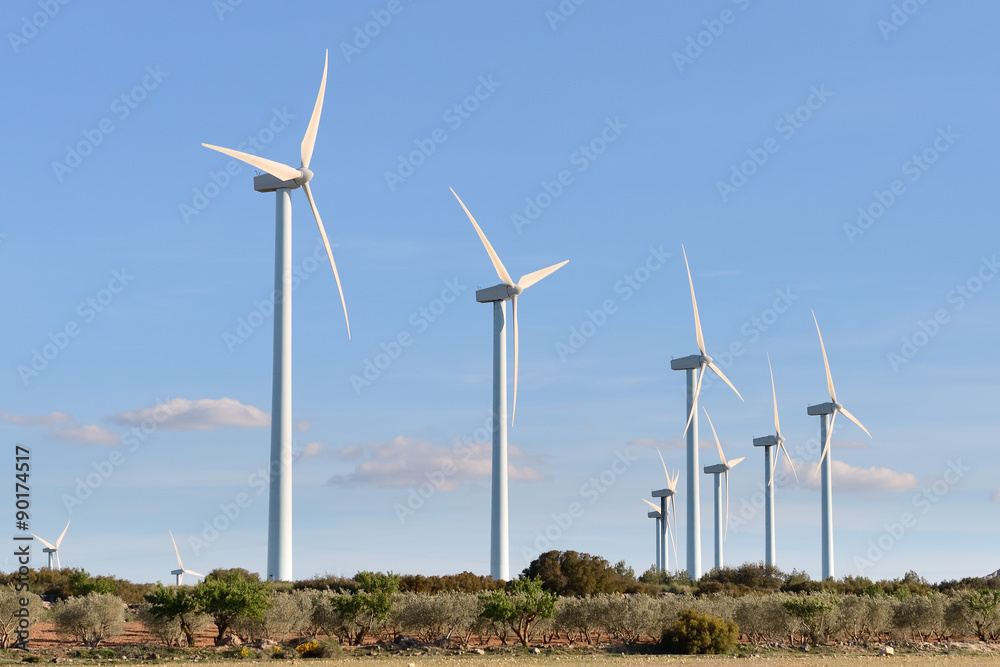 wind turbines against the blue sky wind turbines against the blue sky