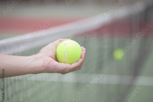 woman hand holding the tennis ball