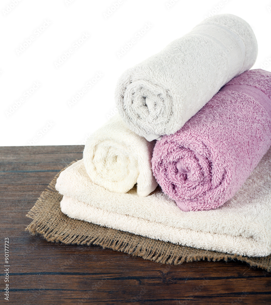 Soft towels on table isolated on white Soft towels on table isolated on white