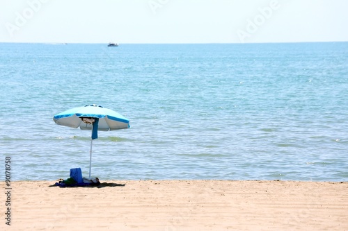 isolated beach umbrella on the beach