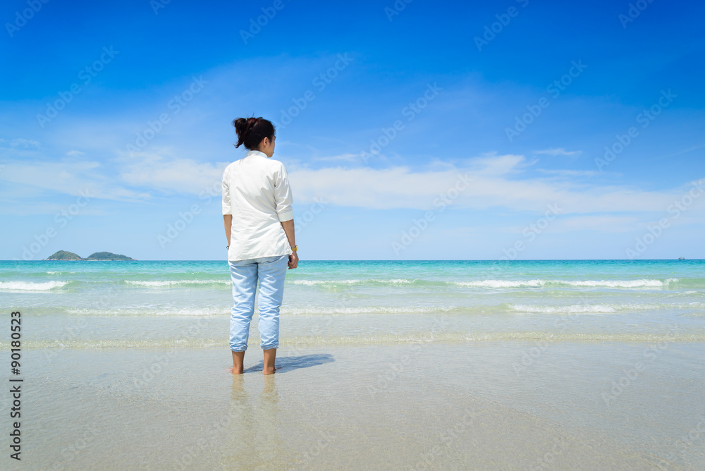 woman walks on a beach