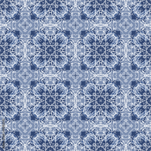 Seamless Calligraphy Pattern in white and blue. Seamlessly repeating ornamental wallpaper or textile pattern with handwriting on blue background in vector format. 