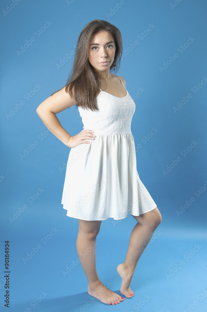 Young girl in a white dress with long hair..