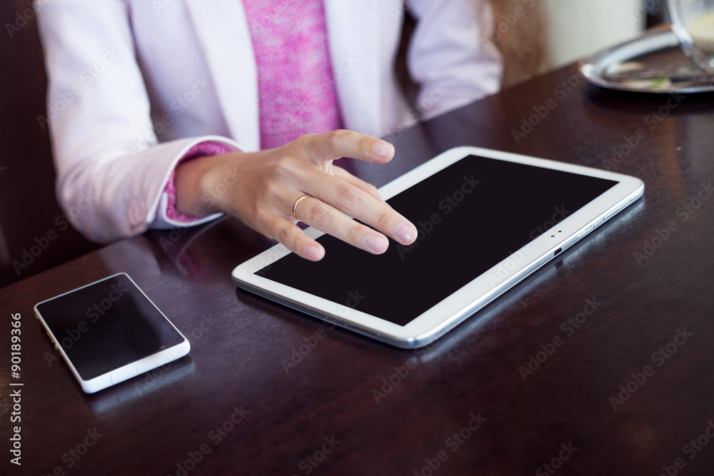 photo mockup. girl works on the digital tablet, a small depth photo mockup. girl works on the digital tablet, a small depth