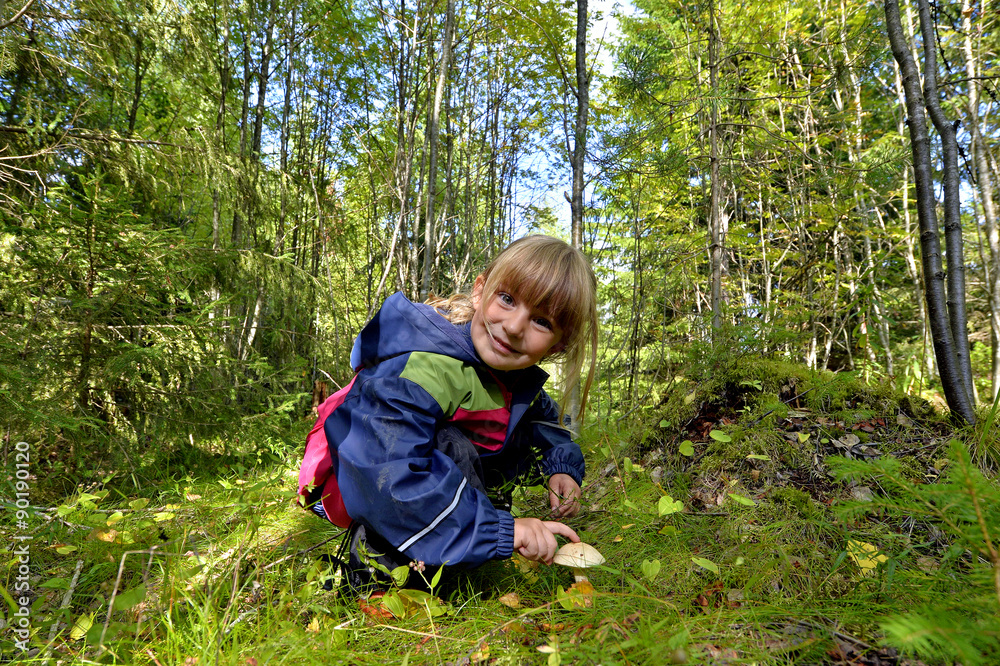 Adorable little girl hiking in the forest on summer day. Adorable little girl hiking in the forest on summer day.