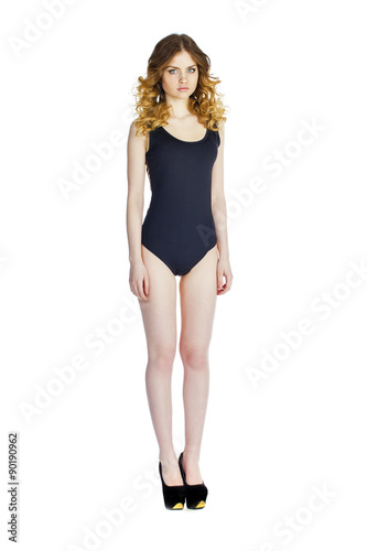 Model Tests, Young slim woman posing in black leotard © Andrey_Arkusha