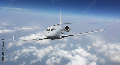 Frontal view of a private jet flying