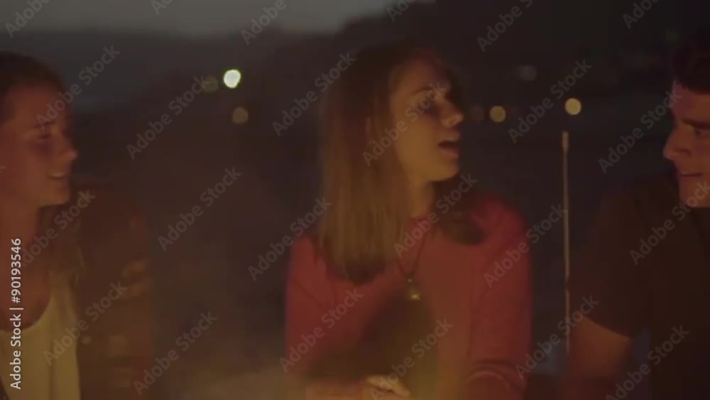Attractive teenagers dance and sing to music at the beach Attractive teenagers dance and sing to music at the beach