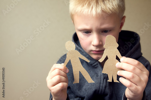 Confused child with paper parents