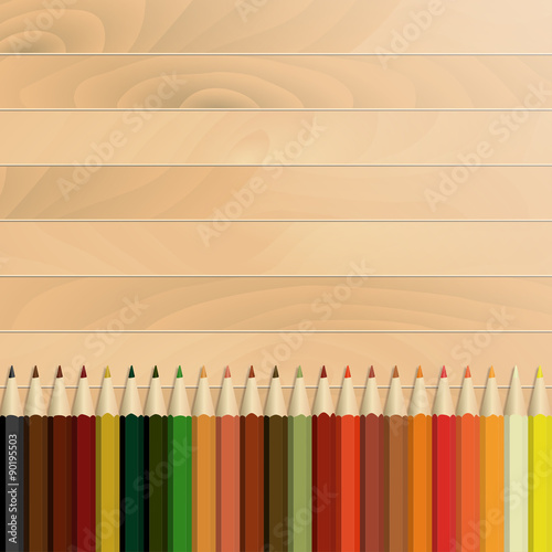 Pencils multicolored autumnal, wooden background / texture
