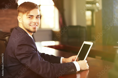 Businessman working with ta...
