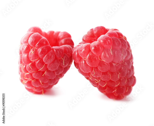Red sweet raspberries isolated on white