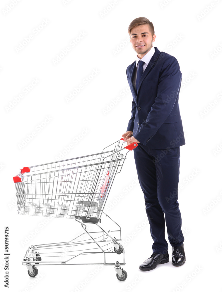 Young man with empty shopping cart, isolated on white Young man with empty shopping cart, isolated on white