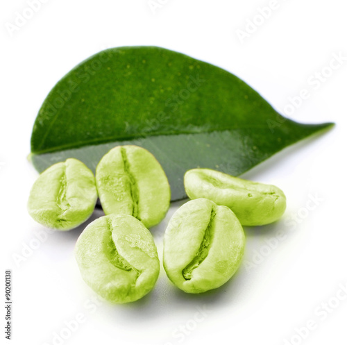 Green coffee beans with leaf isolated on white