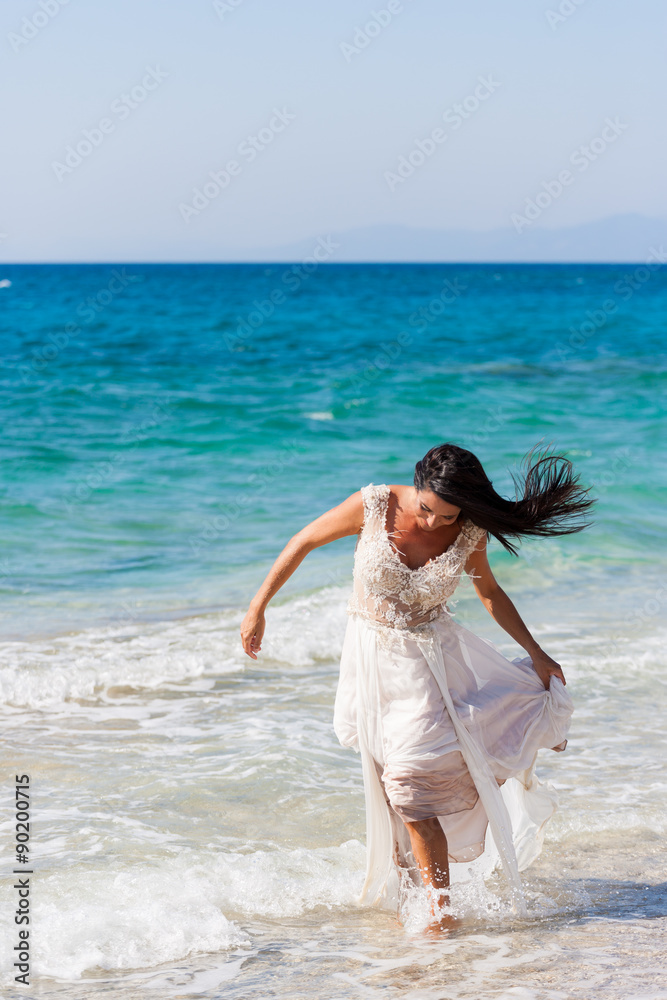 bride in her snow-white dress on the beach bride in her snow-white dress on the beach